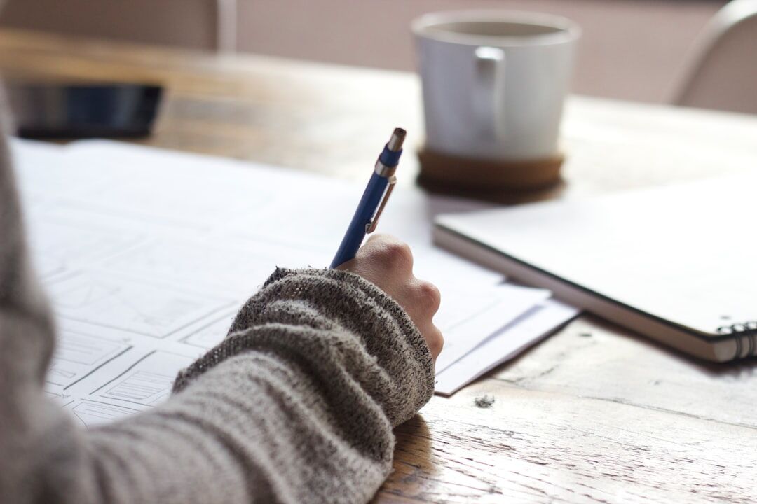 person writing notes
