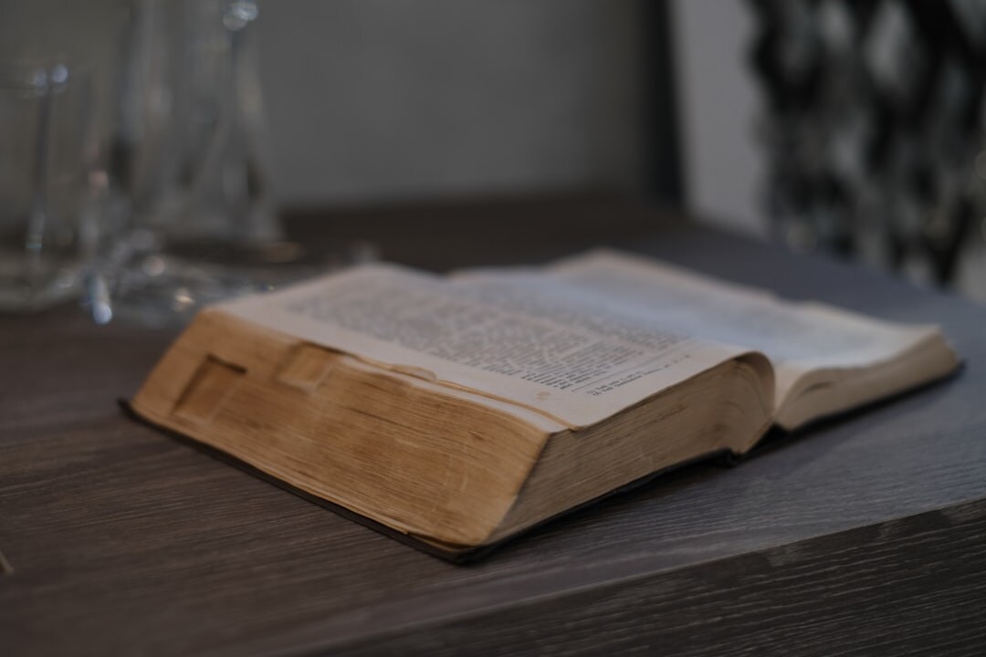 old mystery book on wooden table